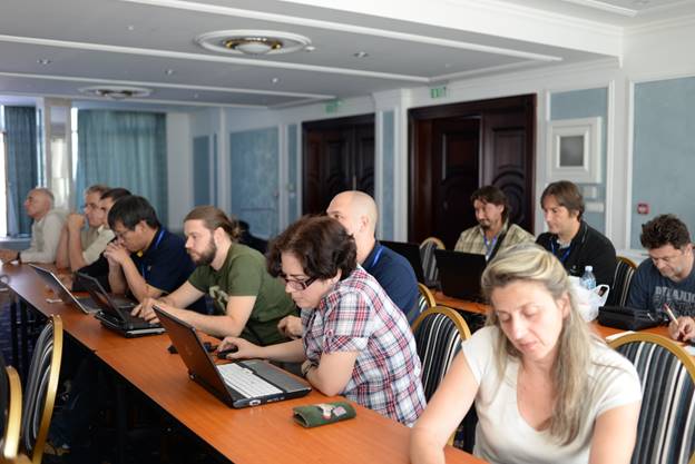 A group of people sitting at a table

Description generated with very high confidence